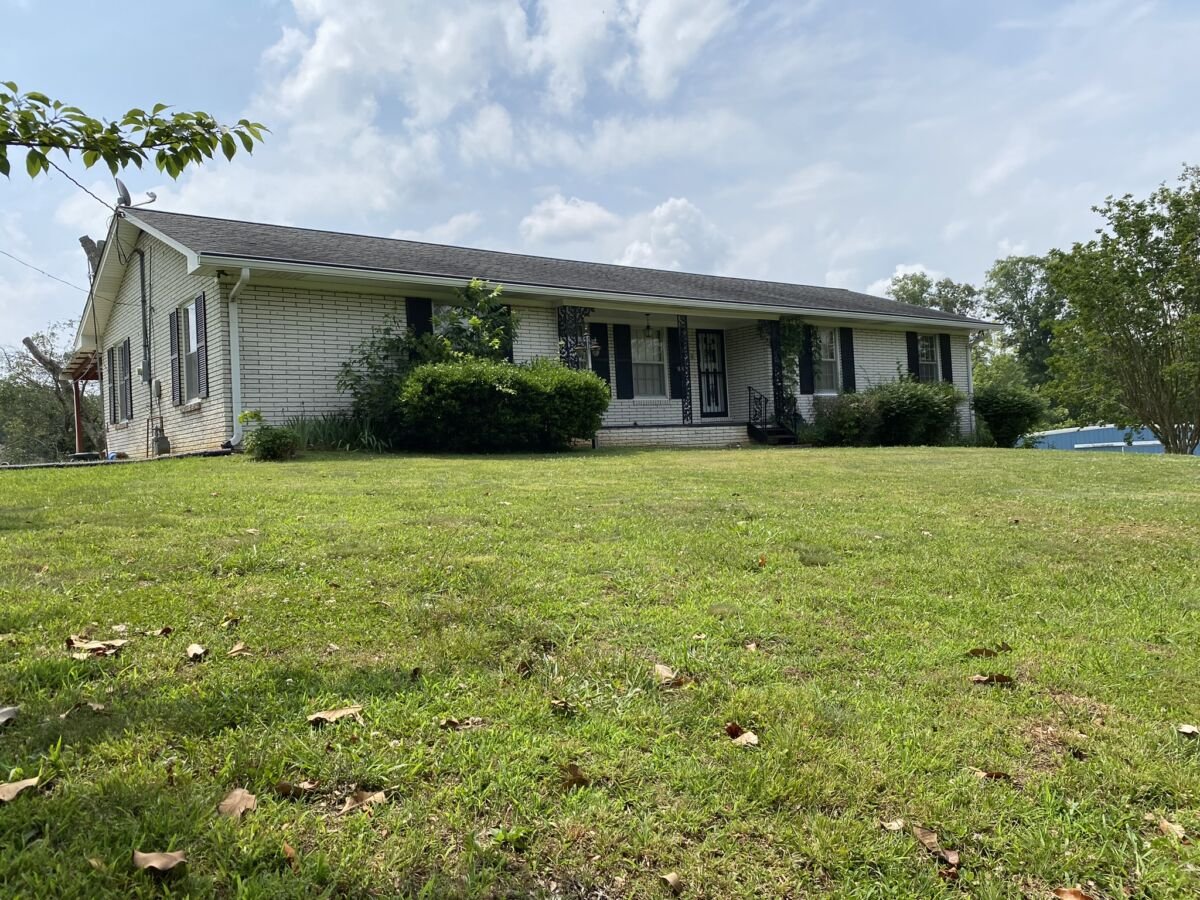 Commercial Building & 4.2 Acres • Brick Home • Basement • Building Lot • 3 Tracts • Personal Property