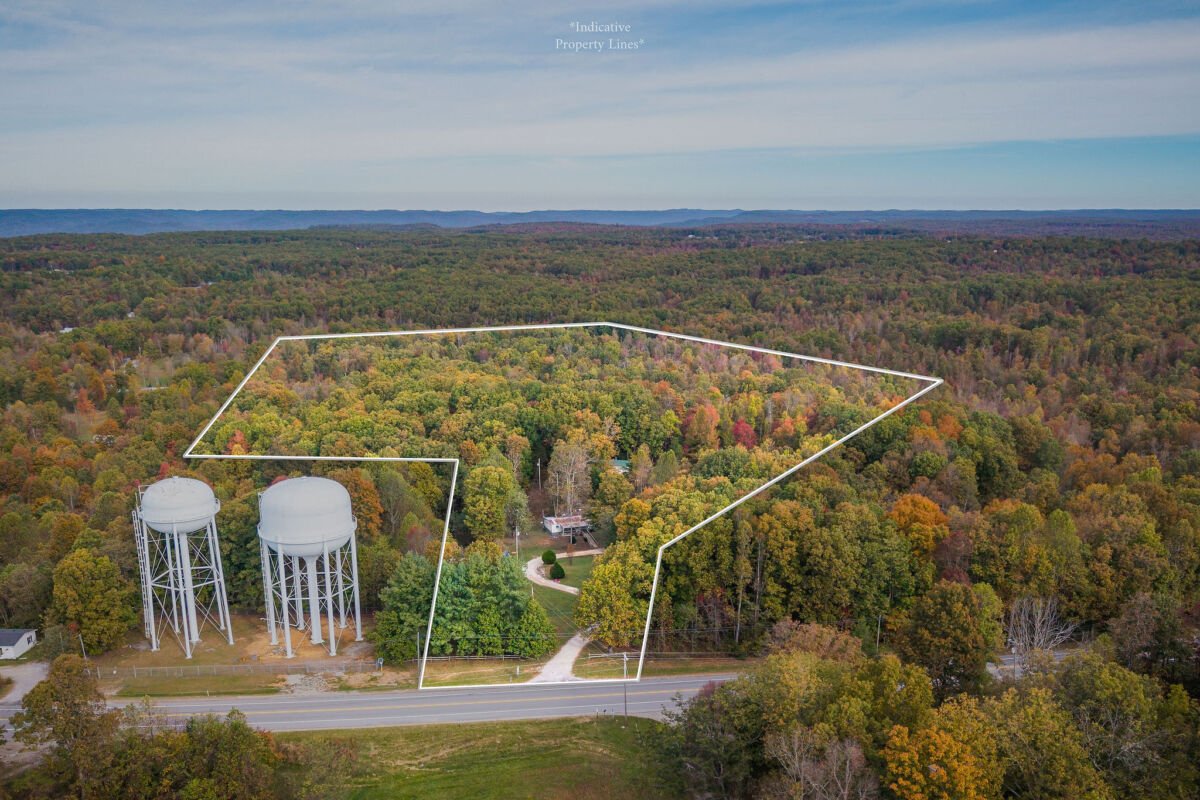 2 Homes & 5.19+- Acres • Unrestricted • Pond